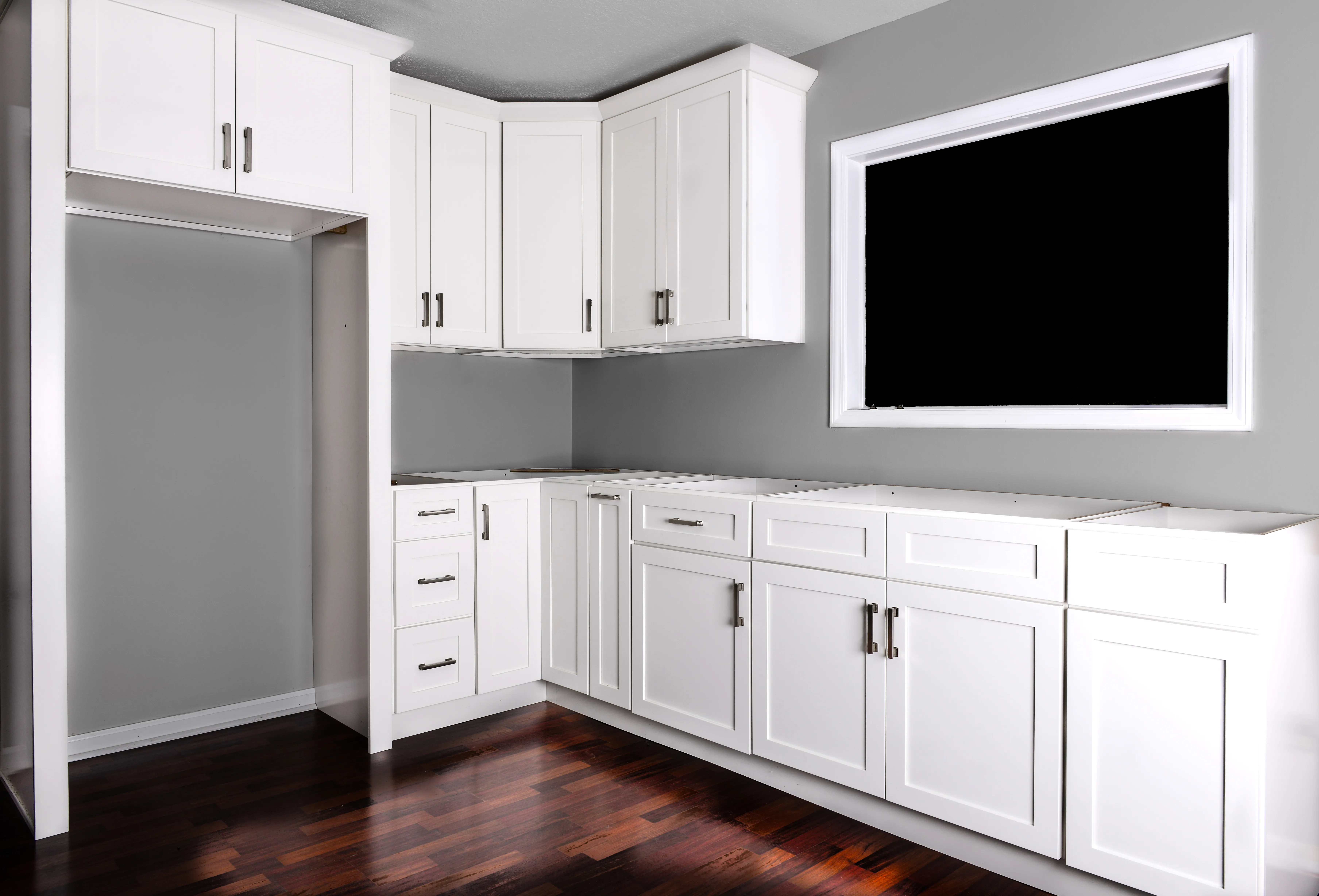 Display kitchen with white shaker cabinets in the Cascade Cabinets showroom